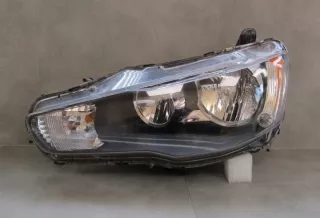  Фара левая Mitsubishi Lancer 8 Арт e12521697
