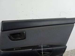 Обшивка двери задней правой (дверная карта) Mazda 3 BK 2004г.  - Фото 2