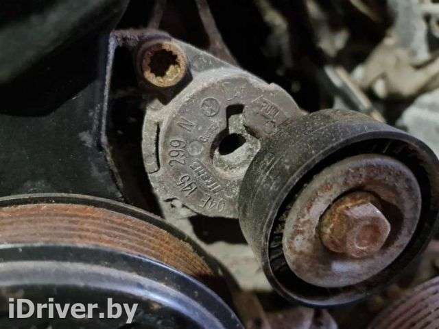 Натяжитель ремня генератора Volkswagen Jetta 6 2014г. 04E145299N - Фото 1