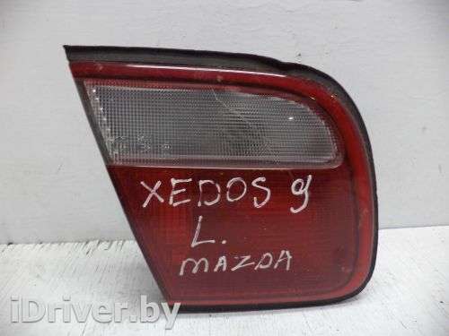 Фонарь крышки левый Mazda Xedos 9 1999г.  - Фото 1
