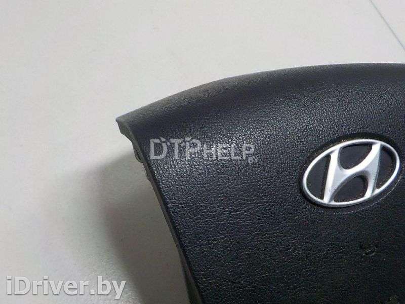 Подушка безопасности в рулевое колесо Hyundai Starex 2008г. 569004H000WK  - Фото 4