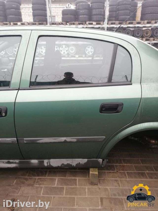 Стекло двери задней левой Opel Astra G 2000г.  - Фото 1