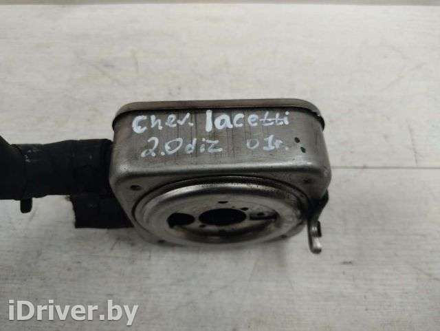 Теплообменник масляного фильтра Chevrolet Lacetti 2004г.  - Фото 1
