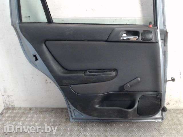 обшивка боковой двери зад лев Opel Astra G 2000г.  - Фото 1