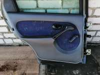  Обшивка двери задней левой (дверная карта) к Fiat Palio 1 Арт 55774030