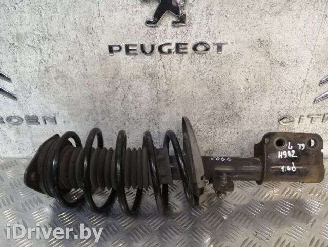 Стойка амортизатора переднего левого Peugeot 308 2 2014г.  - Фото 1