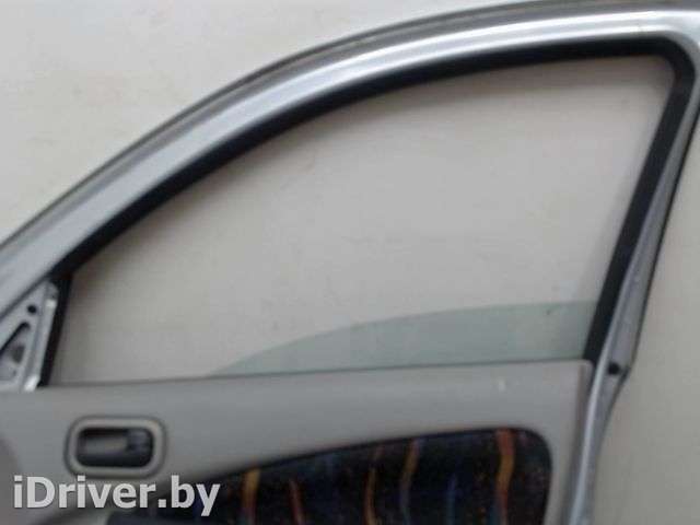 стекло боковой двери перед прав Nissan Almera N16 2004г.  - Фото 1