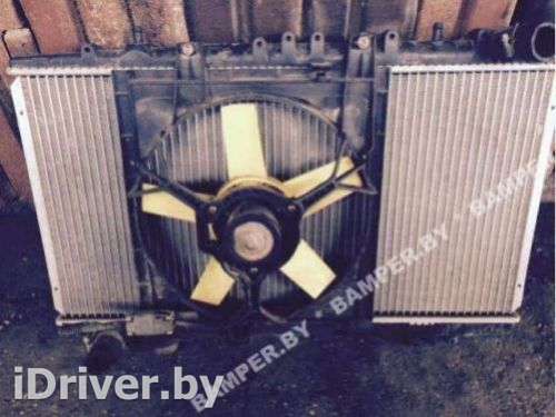 Вентилятор радиатора Nissan Primera 10 1995г.  - Фото 1