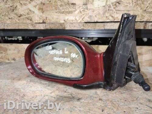 Зеркало левое Kia Sephia 2 2000г.  - Фото 1
