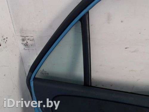 стекло боковой двери (треугольник) зад лев Mitsubishi Carisma 2003г.  - Фото 1